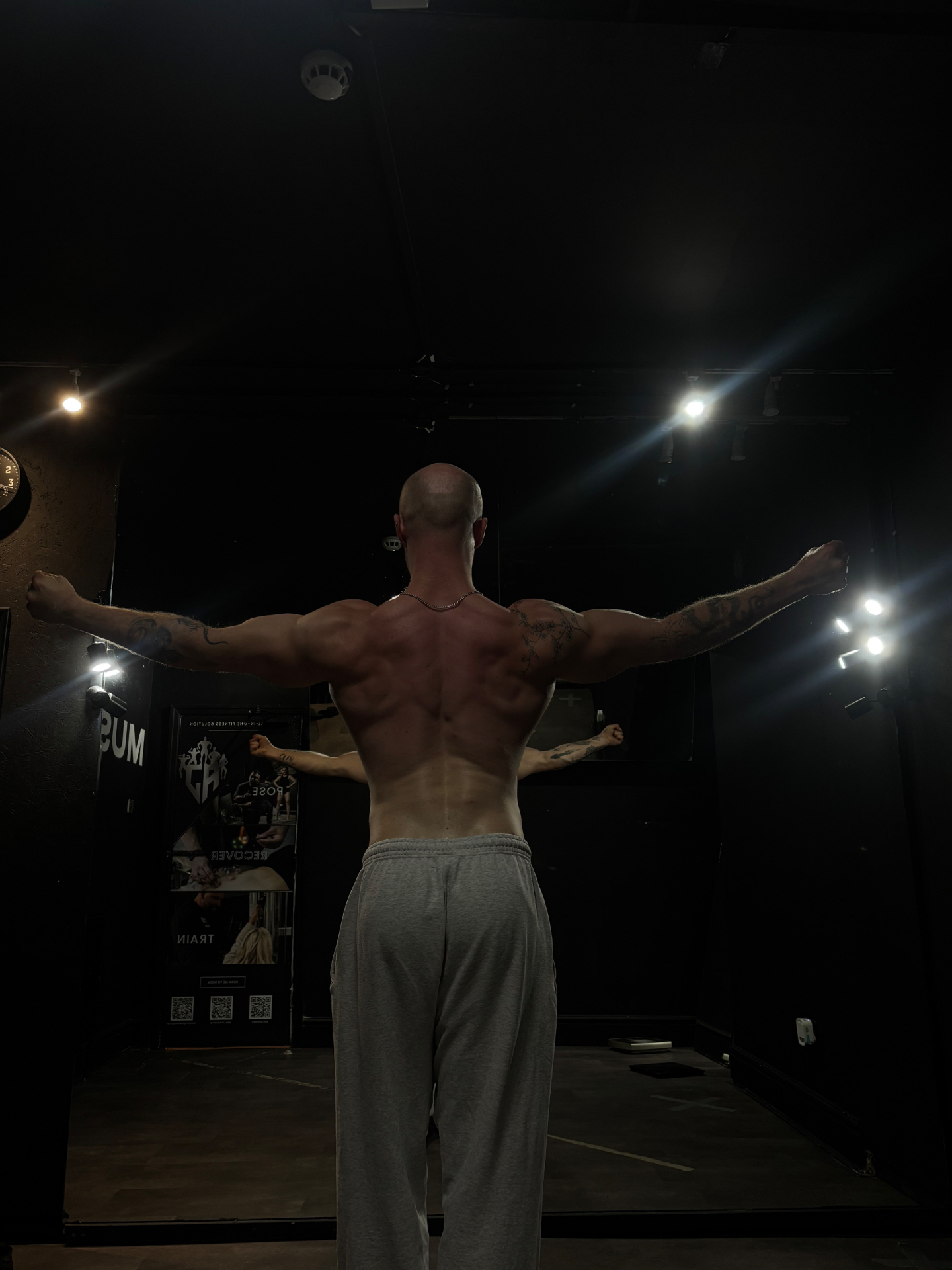 Rear lat spread pose showing back width and conditioning